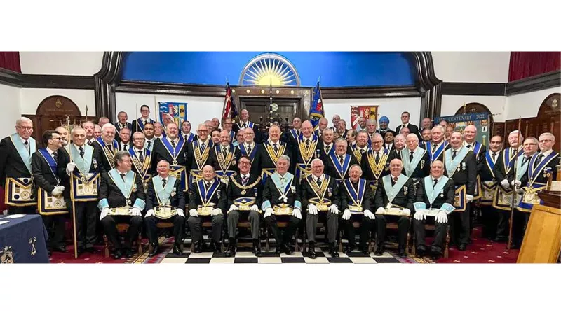 Hainault Lodge members celebrating their Centenary with Paul Tarrant (seated centre left), Maurice Sharp the Worshipful Master (centre) and John Webb (centre right)