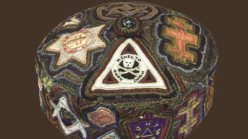 smoking hat with masonic symbols on it