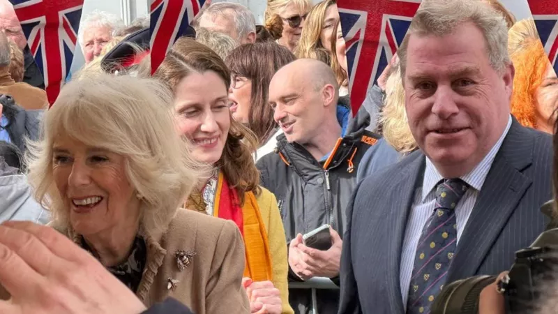 Her Majesty Queen Camilla, being escorted by Freemason Stuart Jones
