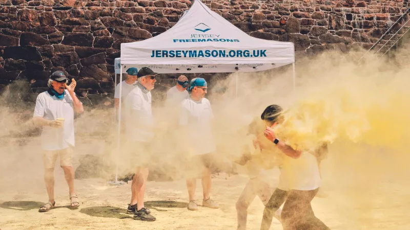Jersey Freemasons taking part in a Colour Run Festival to raise money for Family Nursing and Home Care Charity