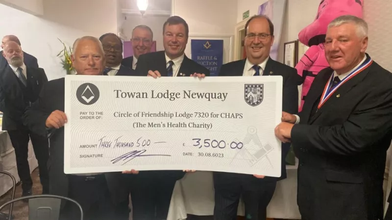 Freemasons with a cheque for charity 