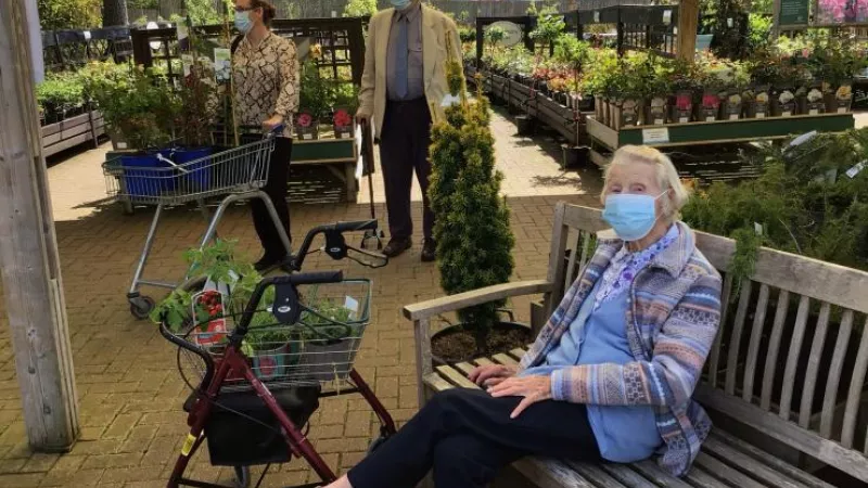 1 / 3 Resident Janet Wigmore poses with the plants she selected for Cadogan Court. Behind, Home Manager Clare Walker and resident Stuart Newham decide what other plants they should pick for the Home's green house.