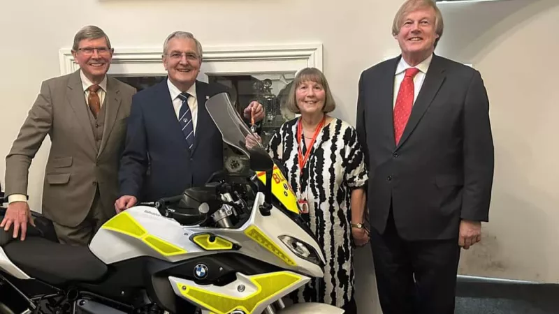 Staffordshire Freemasons and Deputy Grand Master Sir David Wootton standing with the dont