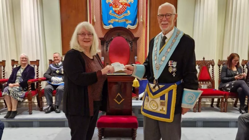 Gloucestershire Freemasons presenting cheque for charity 