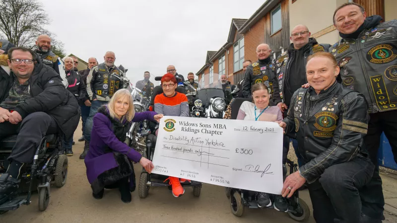 Widows Sons present a cheque to Disability Action Yorkshire