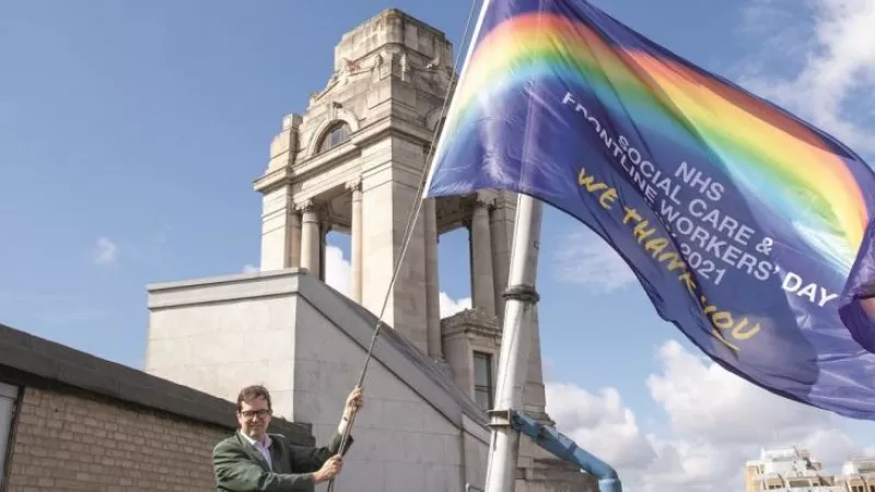 Dr David Staples raises the flag