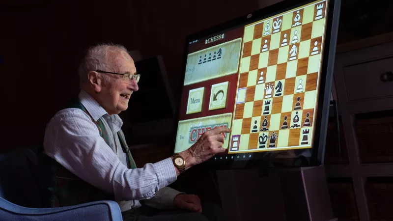 A resident of Connaught Court playing chest