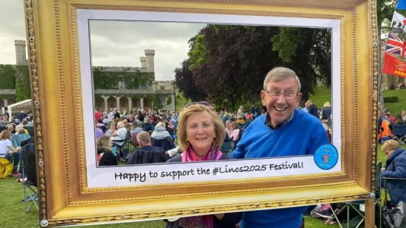 Simon Butler encouraged Concert at the Castle visitors to be photographed in the Province's unique mobile photo frame - for a small donation. This is Peter Brooks, one of the Province's APGMs, and his wife Jackie