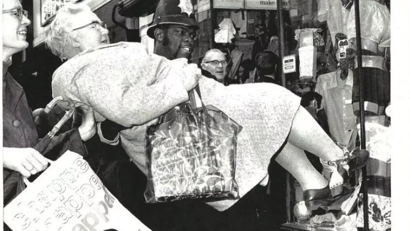 Freemason Norwell Roberts taking an injured lady to Charing Cross Hospital