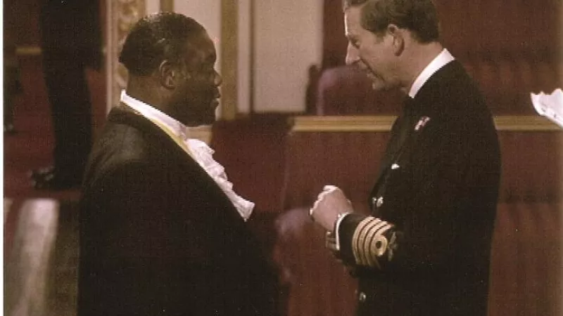Prince Charles investing Norwell Roberts with the Queen’s Police Medal in 1996