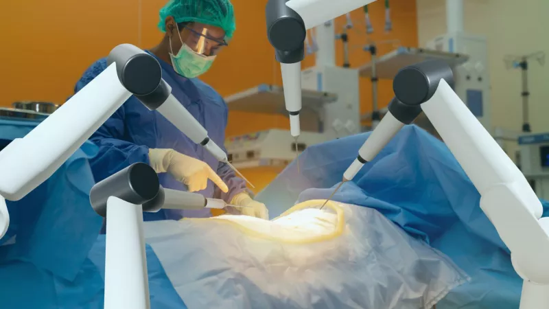 A group of Surgeons using the robot surgery