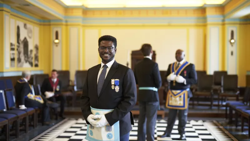 Freemasons wearing regalia in a Lodge meeting