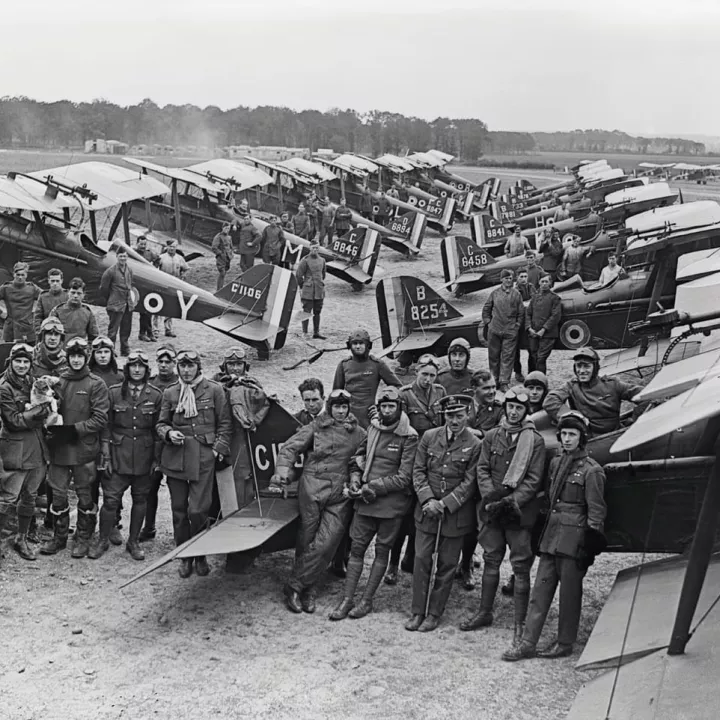 British Officers and SE 5a Scouts of No. 1 Squadron. The group includes two Americans, Lieutenants D. Knight and H.A. Kuhlberg, July 1918