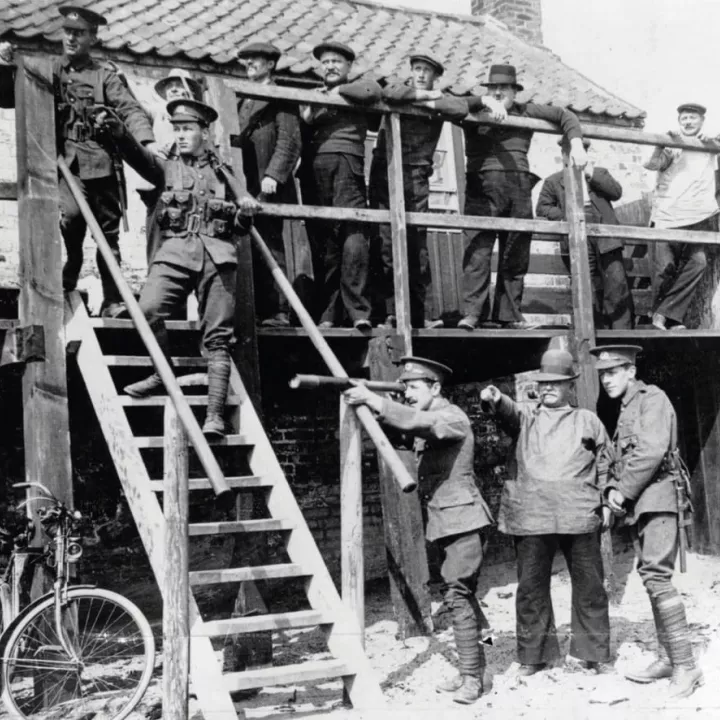 Soldiers and civilians on east coast of England keeping watch for enemy ships, c.1917