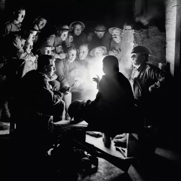 British soldiers gathered around a lamp