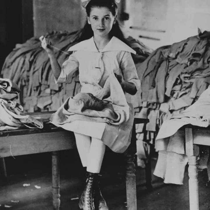 World War I Worker sewing coats for soldiers